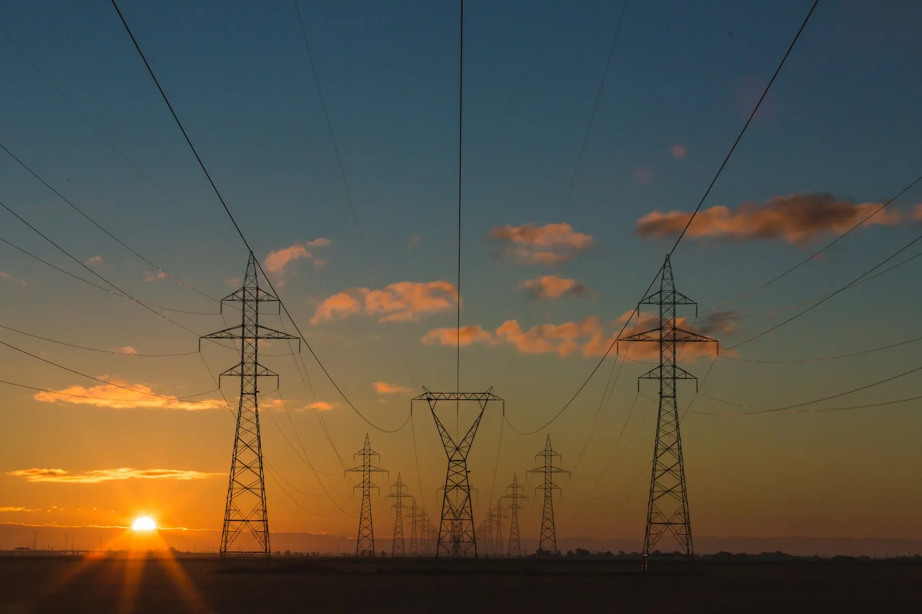 High-voltage transmission lines at dusk